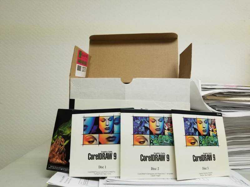 lot 2373 image: Corel Draw 9 Software and Timeclock