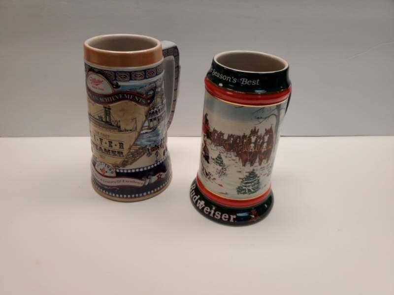 lot 2570 image: Beer Steins- Miller Lite and Budweiser Holiday 1990s