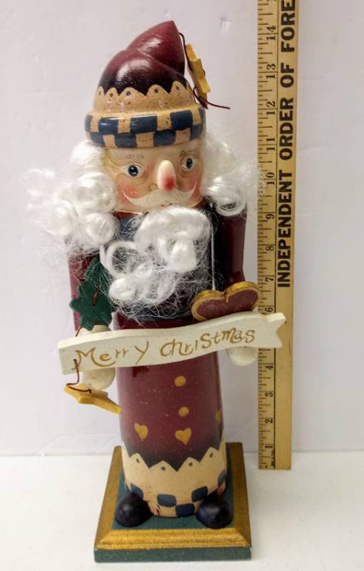 lot 3148 image: Handsome Santa Nutcracker  Holding Merry Christmas Sign