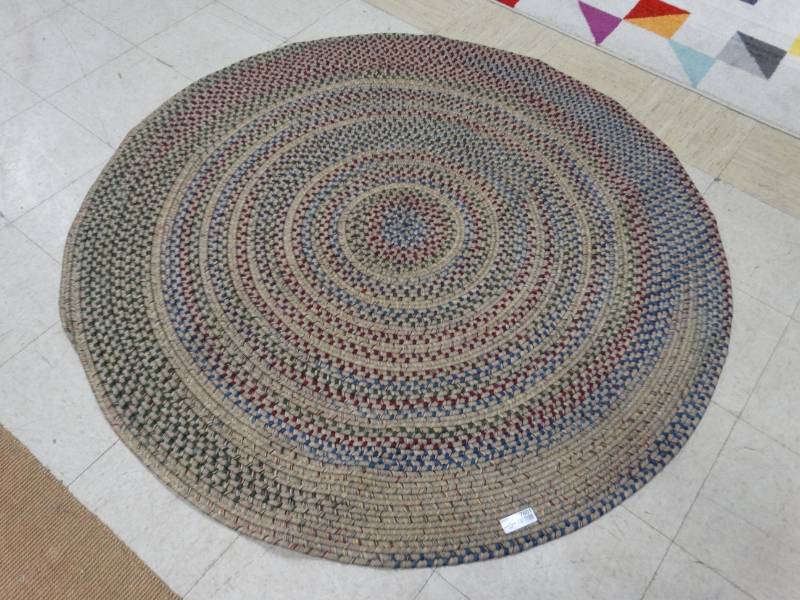 lot 7601 image: Lg round braided area rug- Round