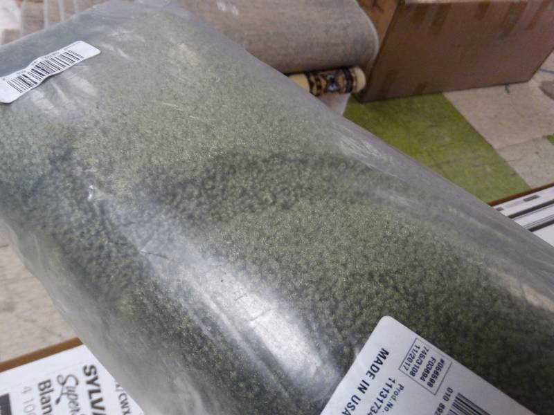 lot 7751 image: New in package Moss Colored Rug