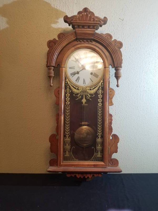 lot 16005 image: Wall Hanging Pendulum Clock w Ornate Wood Case