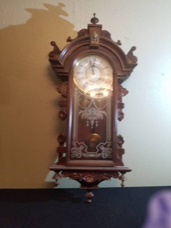 lot 16007 image: Wall Hanging Pendulum Clock w Ornate Wood Case