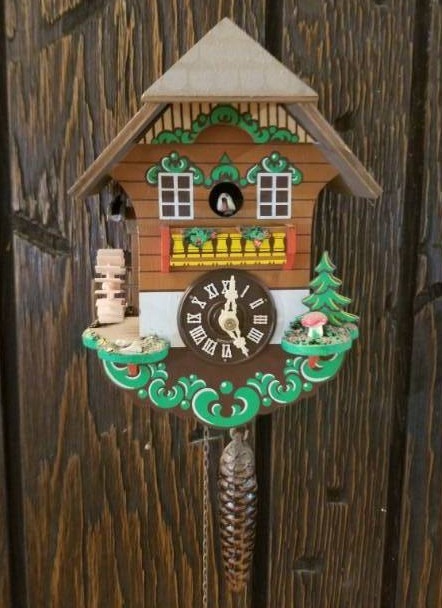 lot 16013 image: Water Wheel Wood Cuckoo Clock w Pinecone Weight