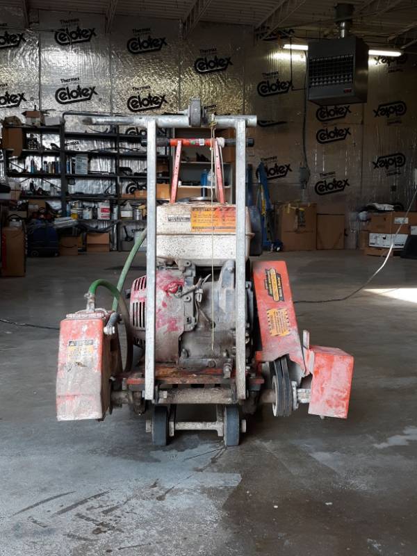 lot 9764 image: Walk Behind Gas Powered Concrete Saw Model C-111