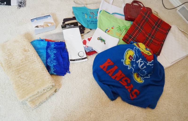 lot 3107 image: Lot of NICE table clothes, rugs and a KU Jayhawk SNUGGIE