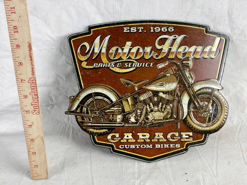 lot 3383 image: Nostalgic Metal Sign Motor Head parts and Service