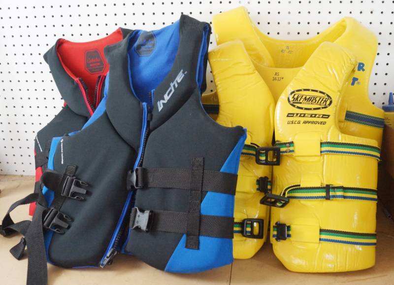 lot 1521 image: Lot of 4 NICE Life Jackets for boating - Various sizes and styles see pics - no smells