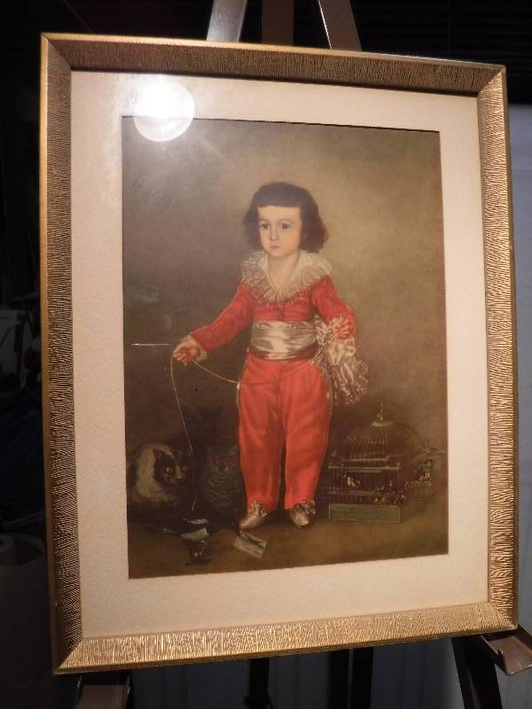 lot 7315 image: Reproduction of DeGoya  Don manuel Boy in red framed art with interesting stories on the back