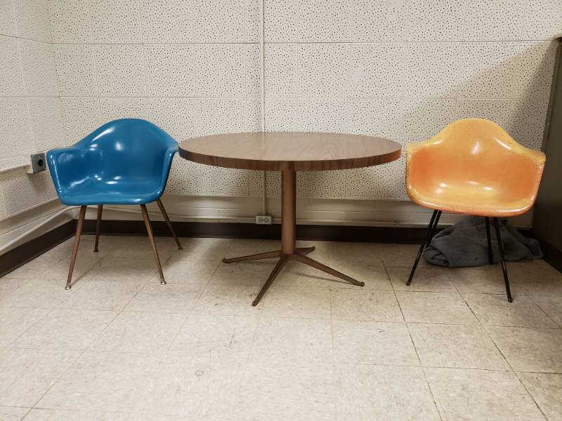 lot 10104 image: Two Fiberglass Molded Chairs and Composite Metal Round Table
