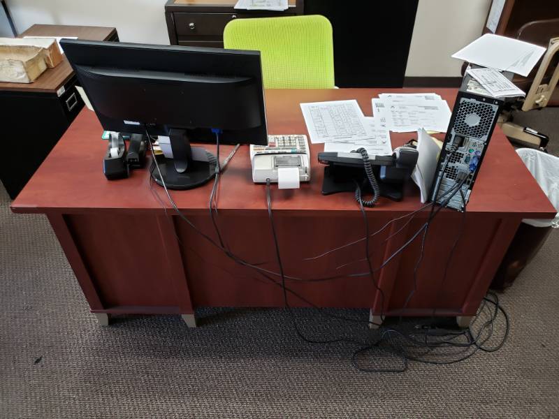 lot 10147 image: Four Drawer Composite Desk Contents Not Included