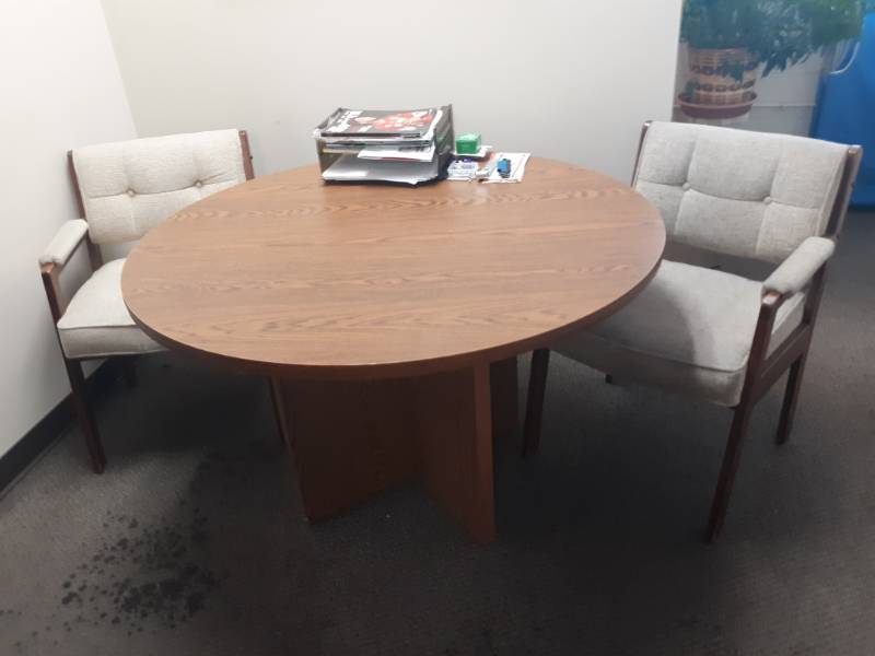 lot 10123 image: Composite Round Office Table and Two Upholstered Arm Chairs