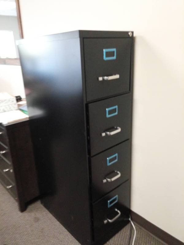 lot 10037 image: Black Metal Four Drawer Filing Cabinet