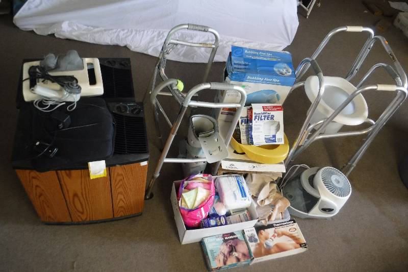 lot 7419 image: Lot of health and beauty items- humidifier- walker- leg boot brace and more
