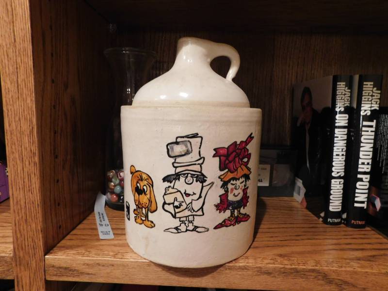lot 3449 image: Ceramic Growler, Books and VHS Tapes
