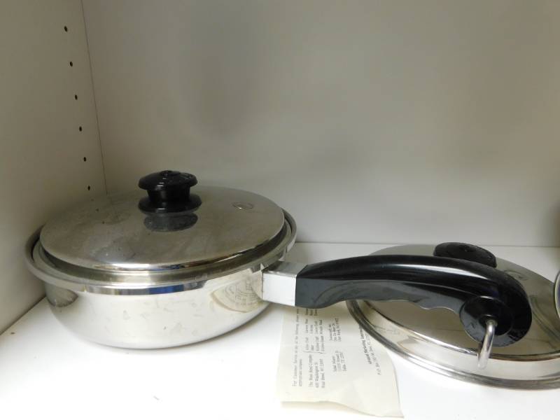 lot 3485 image: 2 Pans with Lids, Cleaning Products, The Great American Stone Factory Large Ceramic Bowl, Koozies and Pasta Strainer