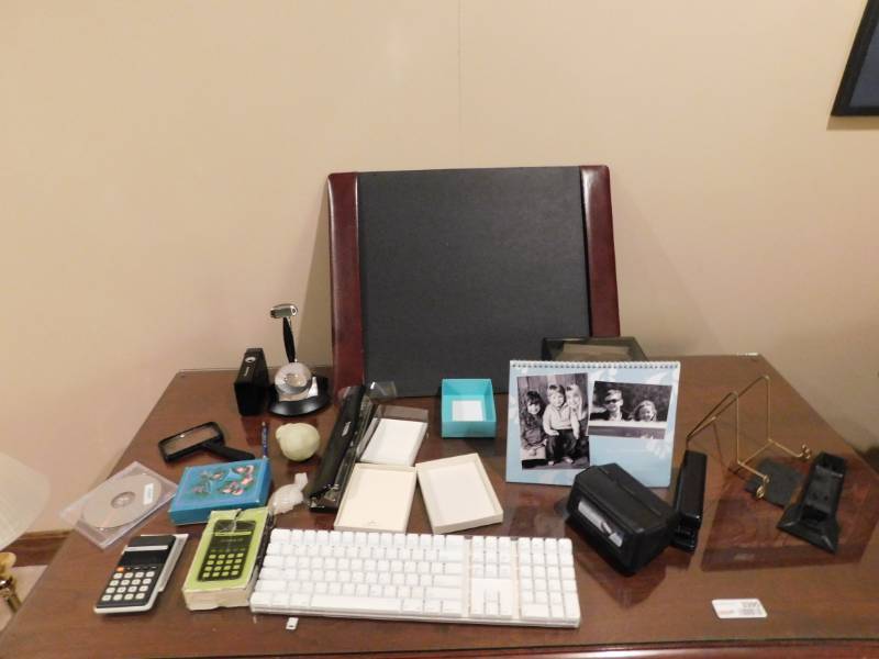 lot 3495 image: 1941 US Liberty Half-Dollar Encased in Glass, Casio M1 Calculator, Keyboard, 3 Hole Punch, Stapler and Misc. Office Supplies