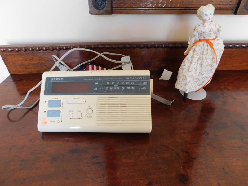lot 3577 image: Kaiser Doll on a Stand and Sony Dual Alarm Clock and Radio