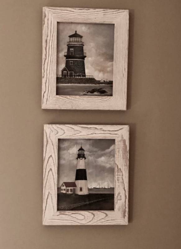 lot 2094 image: Set of two white washed framed lighthouses