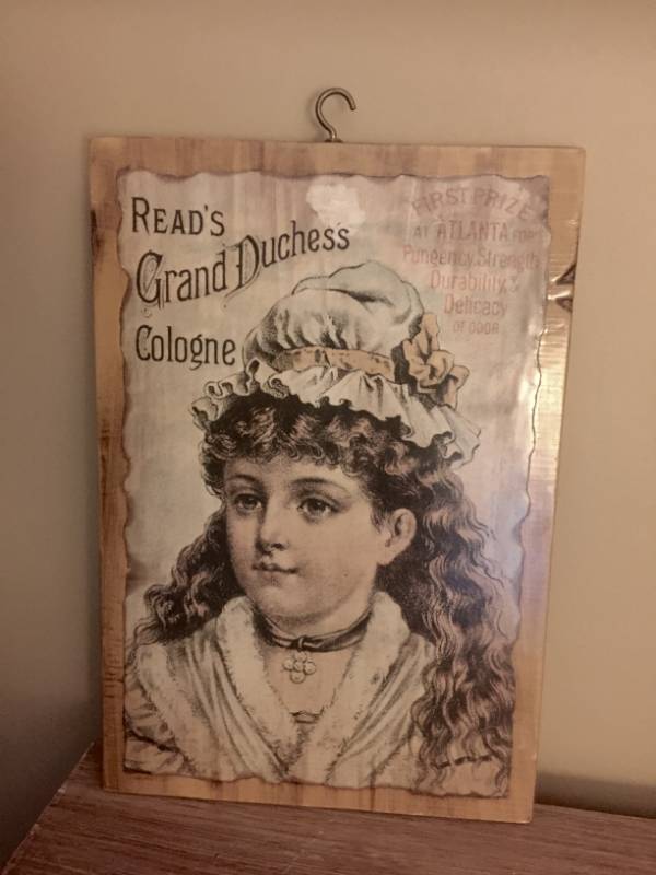 lot 2116 image: Reads Grand Duchess Cologne Vintage Advertisement on hanging wood plank