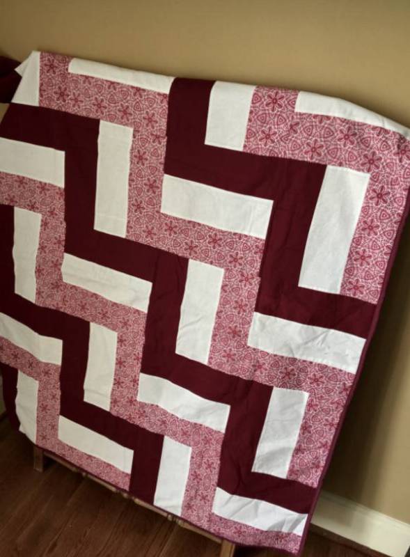 lot 2138 image: Rust and Cream colored quilted throw