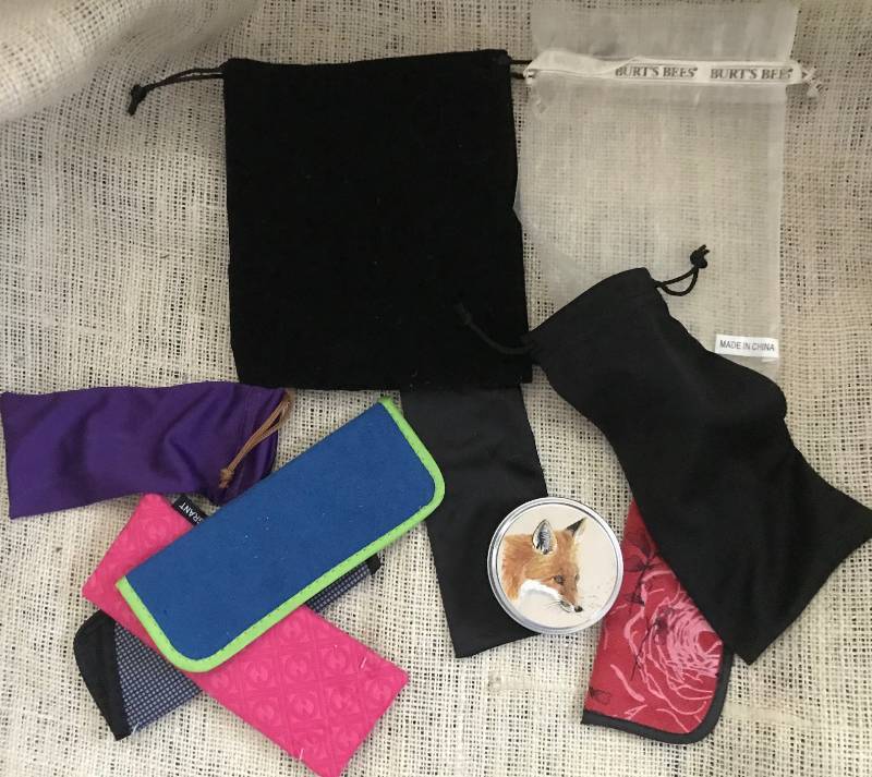 lot 2143 image: Assortment of bags, glass holders, etc.