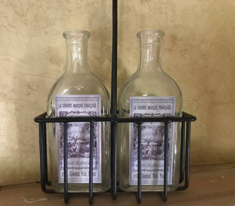 lot 2160 image: French labeled bottles in holder