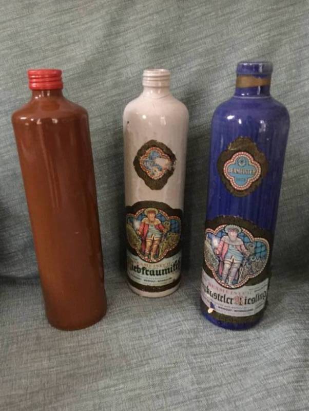 lot 2176 image: Set of 3 Collection of Clay wine bottles