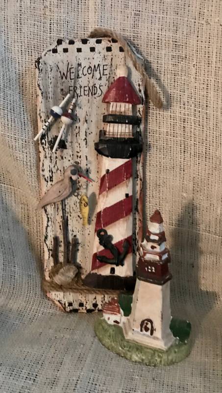 lot 2184 image: Lighthouse door stop and hanging door wood sign