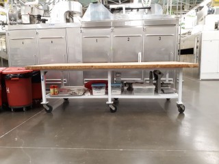 lot 6369 image: Butcher Block Table With Non Stick Cooking Spray, Plastic Cutting Boards And More