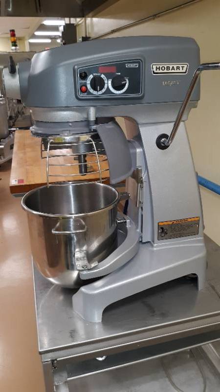 lot 7186 image: Hobart Legacy Mixer 100-120V 1Ph., w Mixing Bowl (20QT), 2 Cooking Pans, 2 Whisks, 2 Dough Hooks, Patty, and Cooking PanMixer Cart, 20 QT Mixer BUT All 12 QT Attachments