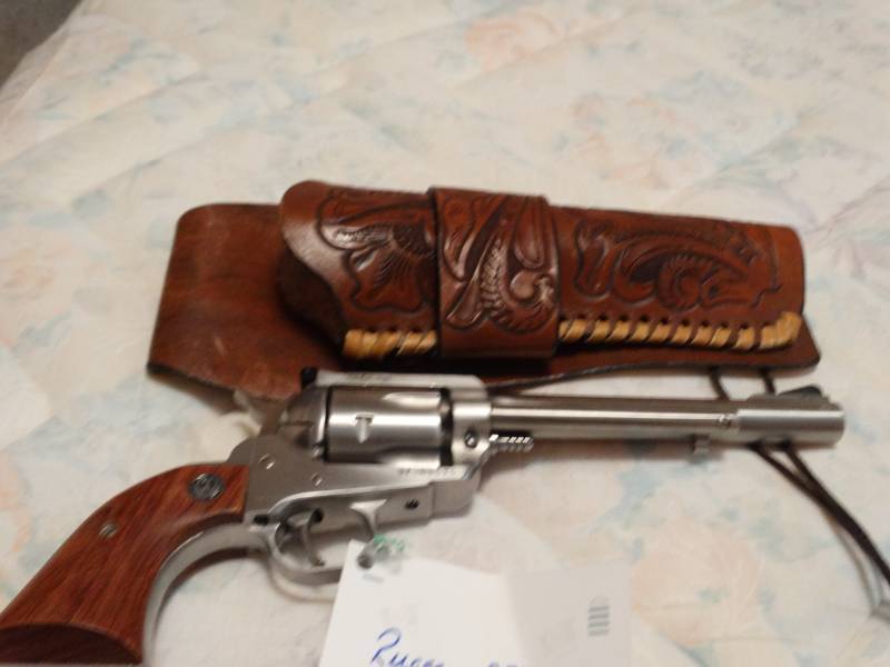 lot 5649 image: Ruger .357 Mag- New Model BlackHawk- Comes with western style leather holster
