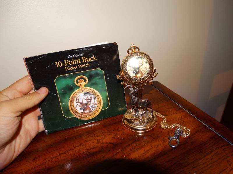 lot 5831 image: The Franklin Mint 10 Point Buck pocket watch with booklet and display stand
