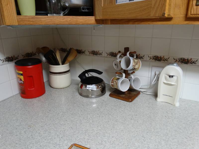 lot 5898 image: Electric can opener, mug tree with misc mugs, assorted kitchen utensils
