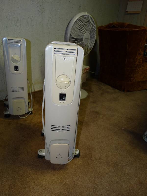lot 6019 image: Oil heater on wheels