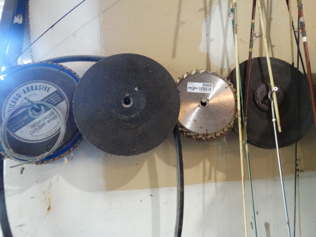 lot 6066 image: Lot of saw blades on wall