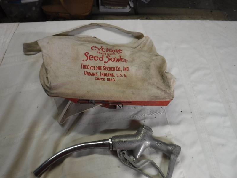 lot 8132 image: Vintage Seed sower and fuel pump nozzle