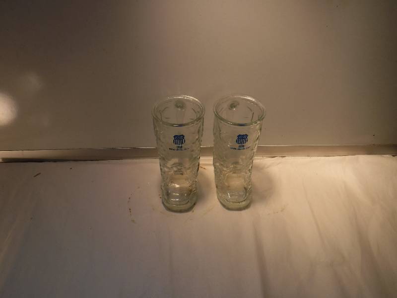 lot 8212 image: pair of Union pacific boot shaped drinking glasses