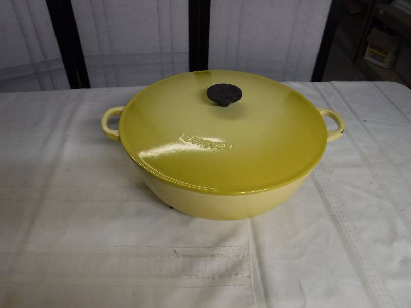 lot 8345 image: Le Creuset cast iron yellow cooking pot with lid