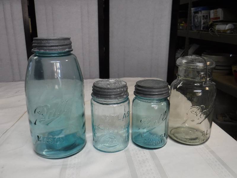 lot 6555 image: Vintage glass jars- Blue ball and atlas 3 zinc lids one flip top
