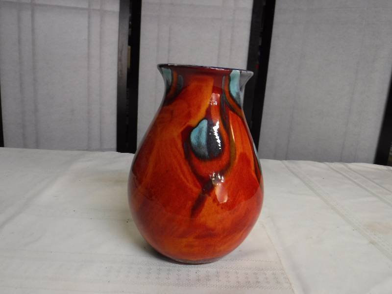 lot 6597 image: Poole Art pottery Vase made in England- orange glaze with drip edge