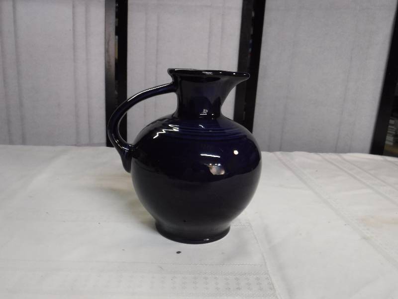 lot 6600 image: Deep blue Fiesta ware pitcher