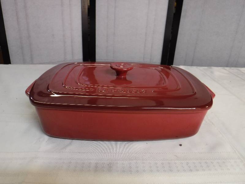 lot 6610 image: Le Creuset deep orange glaze baking dish with lid