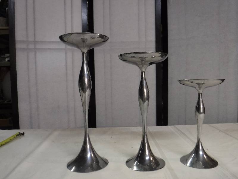 lot 6622 image: Trio of candle holders by Nambe designed by Steve Cozzolino
