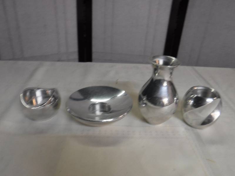 lot 6624 image: Mixed lot of vases and candle holder by Nambe created by Neil Cohen numbered and dated