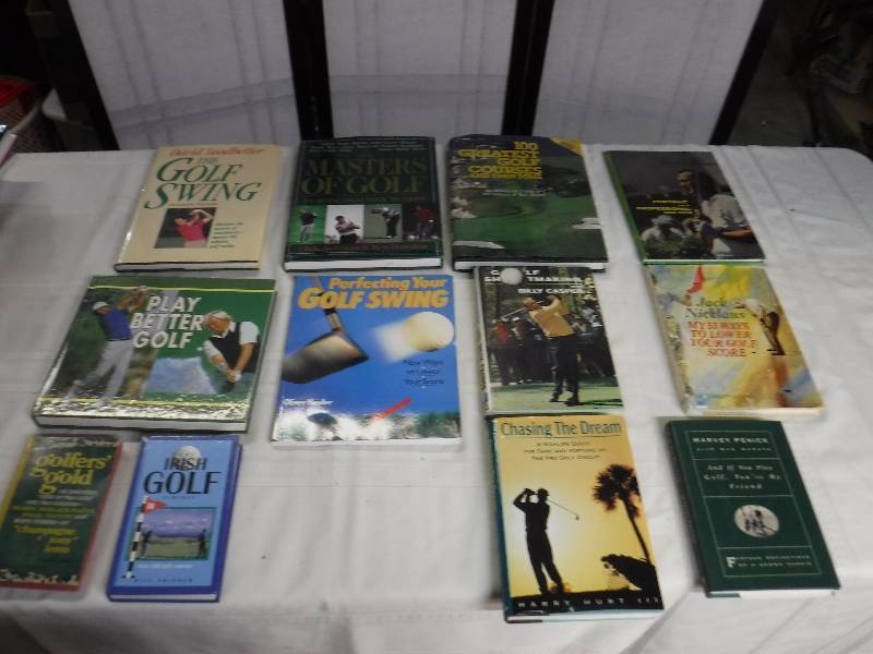 lot 8342 image: Golf book lot with throw pillow