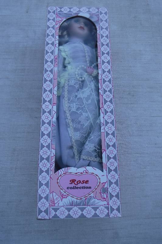 lot 7457 image: Rose Collection porcelain doll- bride