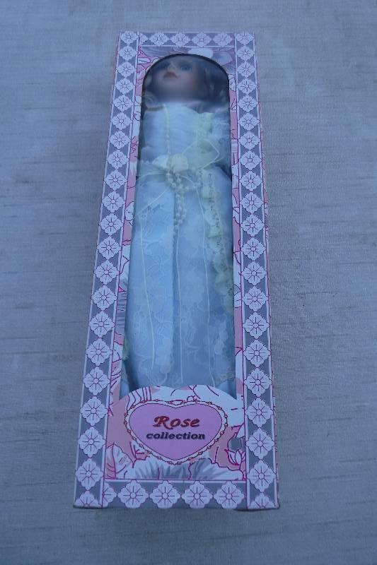 lot 7458 image: Rose Collection porcelain doll- bride