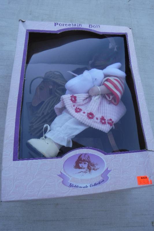 lot 7463 image: Golden collection porcelain doll