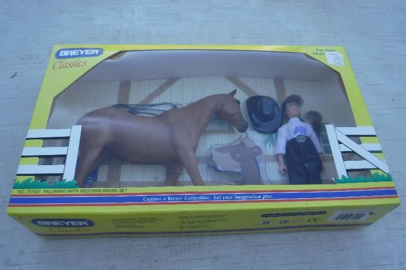 lot 7486 image: Breyer Palomino with western riding set toy horse and rider doll